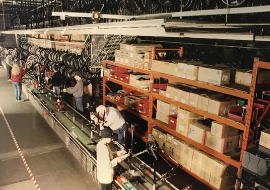 Warehouse shelves filled with cycling products and accessories